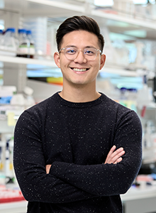 photo of Patrick Hsu standing in his lab